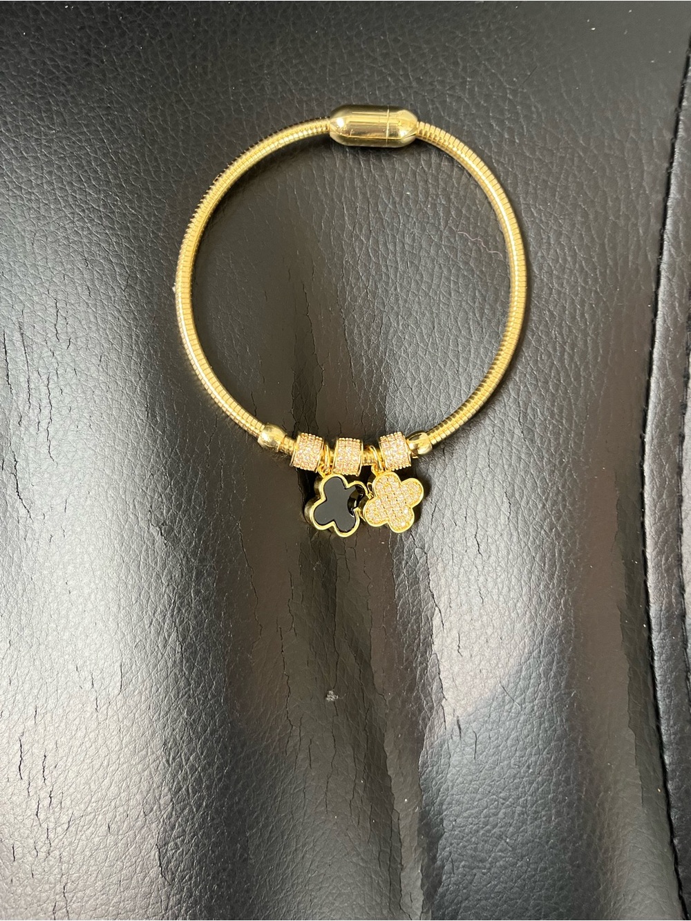 Gold Flower Charm Bracelet with Black and Gold Accents